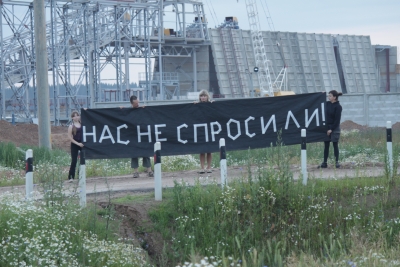 &quot;They didn&#039;t ask us!&quot; banner in front of the construction site of the plant in Ostrovets, Belarus.